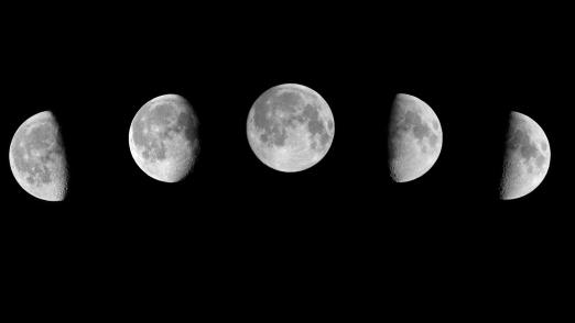 Phases of the moon on a black background
